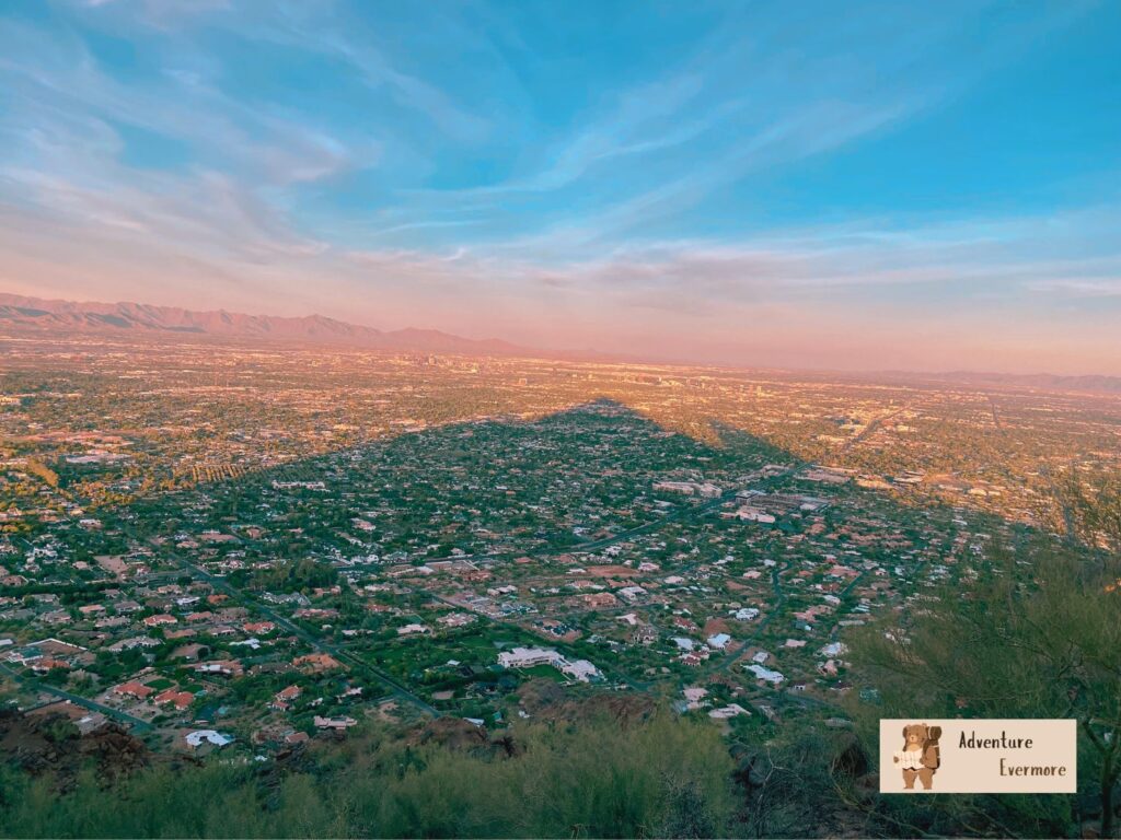 You can see the shadow of the camel as the sun rises over the mountain. 