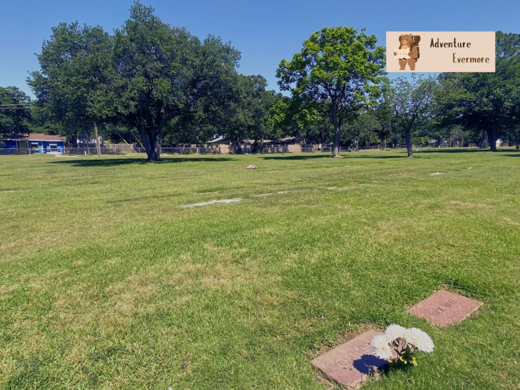 After the red mausoleum, go left up the stairs and search for his gravesite. 